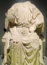 A statue of a person in a robe
Description automatically generated